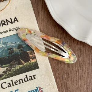 Detail view of Korean retro colorful resin snap hair clip for stylish side bangs and daily wear.