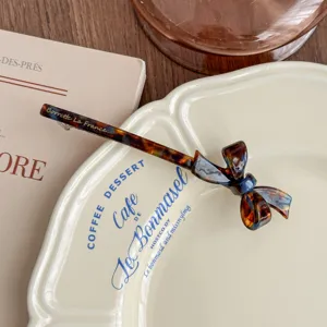 Korean acetate tortoise bow barrette hair clip elegant vintage hair accessory detail view.