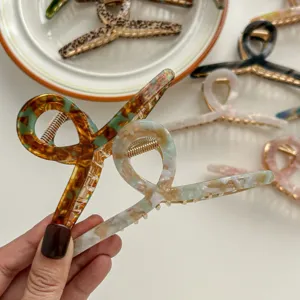 Elegant acetate hair claw clip for women, stylish geometric hair accessory for daily styling.