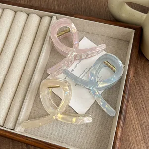 Minimalist nacre hair claw clip, mermaid gloss cross shape shark clip for elegant daily hairstyles.