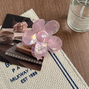 Pink iridescent floral hair claw clip, chic aesthetic design for elegant daily hairstyles.