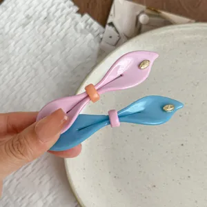Sweet candy color bow hair clip detail, willow leaf spring clip for women and cute daily styling.