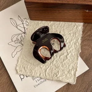 Chic brown acetate hair claw clip for women, elegant French style shark clip for hairstyles.