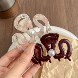 Pearl wave hair claw detail, elegant medium shark clip for women's stylish daily hairstyles.