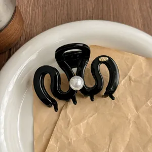 Elegant black hair claw clip with pearl detail, medium size shark clip for women's daily hair styling.