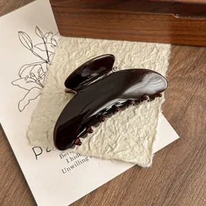 Dark brown glossy cellulose acetate hair claw clip, elegant shark clip for women's styling.