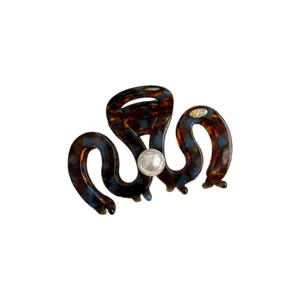 Tortoiseshell hair claw clip with elegant pearl accent, trendy medium shark clip for women.