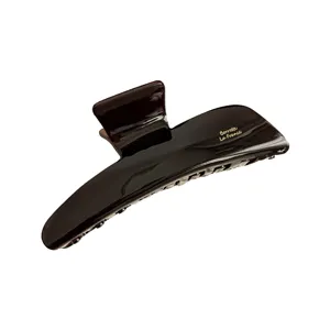 Brown cellulose acetate hair claw clip, elegant large shark clip for women's daily styling.