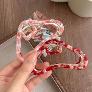 Molla per capelli nuvola irregolare in acetato per acconciatura chic, dettaglio metallo.