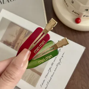 Detailed close-up of colorful dopamine acetate side hair clips for stylish bangs and hairstyles.