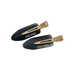 Acetate hair clip for women, stylish black side bangs clip with gold details for daily hair styling.