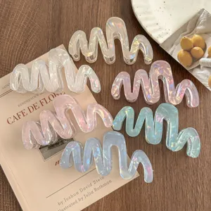 Irregular wave acetate hair claw clip with holographic iridescent finish for women and girls.