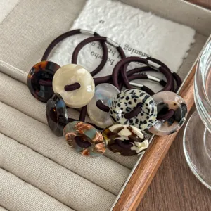 Retro acetate button hair ties featuring tortoiseshell and leopard round designs for women.