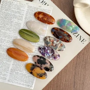 Elegant acetate oval hair clips for women, stylish tortoiseshell side barrettes, fashion accessories.
