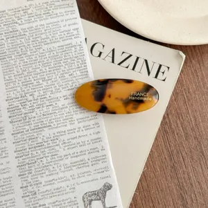 Acetate oval hair clip detail view, tortoiseshell pattern vintage french barrette for women.