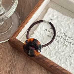 Retro acetate button hair tie with tortoiseshell leopard print design and high elasticity.