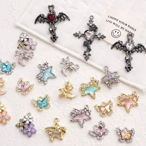 Alloy DIY jewelry charms detail showing assorted rhinestone cross butterfly pendants.