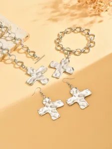 Silver irregular cross jewelry set including necklace, bracelet and earrings for women.