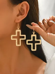 Gold hollow cross drop earrings minimalist alloy jewelry detail shot close up view fashion