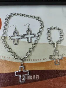 Fashionable silver cross alloy pendant necklace earrings and bracelet jewelry set.