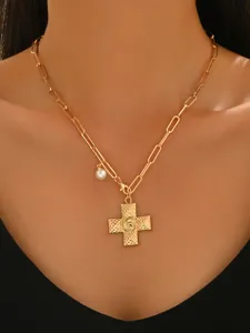 Close-up view of a gold-toned chain necklace featuring a textured cross and pearl pendant detail.