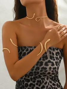 Gold snake jewelry set featuring open choker, armband, and ring for women fashion style.