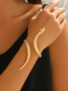 Close up detail of a stunning gold snake arm cuff bracelet, perfect for fashion styling.