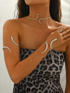 Silver snake jewelry set featuring a choker necklace, arm cuff, bracelet and ring.
