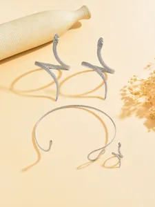 Detailed view of the metallic snake jewelry set showcasing open arm cuffs, choker, and ring.