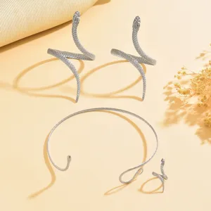 Silver rhinestone snake jewelry set featuring open armlets, choker necklace, and ring.