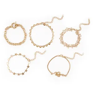 Set of 5 gold-plated fashion bracelets featuring star, heart, flower, and snake charms.