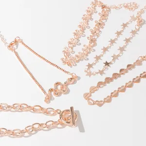 Charming 5-piece rose gold bracelet set featuring snake star and heart links detail