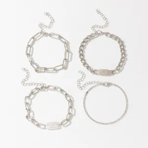 Four-piece silver chain bracelet set featuring freshwater pearls and minimalist metal links.