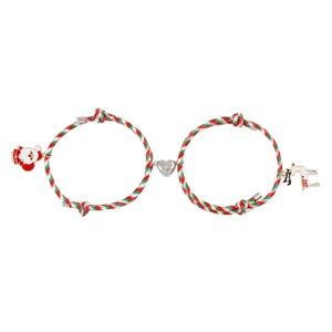 Christmas magnetic couple bracelet set with cute Santa and reindeer charms, festive detail shot.