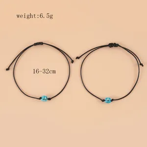 Adjustable black woven rope bracelet with luminous blue bead for women and girls daily wear