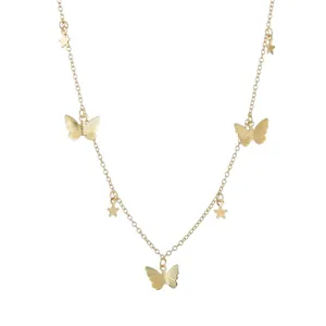Gold butterfly star pendant necklace detail view, delicate fashion jewelry accessory.