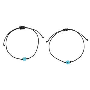 Adjustable black braided rope bracelet with blue glowing bead for daily wear pairs well.