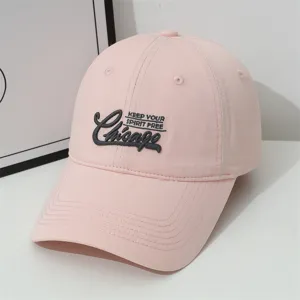 Pink baseball cap detail showing Chicago embroidery and premium fabric, stylish and sun-protective.