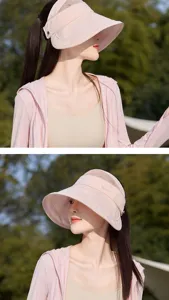 Detailed view of the pink empty-top sun visor hat with breathable half-mesh and wide brim.