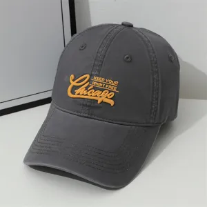 Dark grey embroidered baseball cap with Chicago lettering, soft top wide brim sun hat detail.