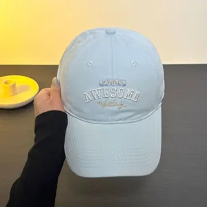Light blue baseball cap with English embroidery, casual sun hat for men and women.