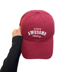 Burgundy baseball cap with chic front embroidery, classic casual sun hat for men and women.
