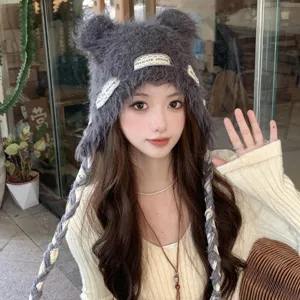 Cute bear ear knit hat for women, winter warm slouchy beanie with braided earflaps and stylish design.