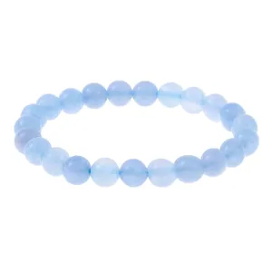 Close-up detail of light blue gemstone bead elastic bracelet, elegant everyday jewelry.