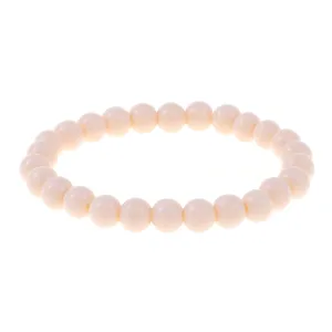 Beige round bead stretch bracelet detail shot, smooth surface, minimalist everyday jewelry.