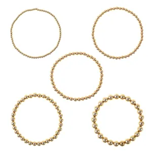 Set di 5 bracciali elastici con perline dorate minimaliste, gioielli impilabili in metallo classico.