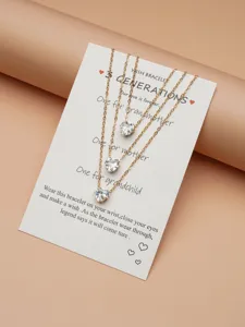 Close-up detail of multi-layer zircon heart pendant necklace displayed on wish card.