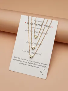 Layered gold chain necklace for women featuring three faceted heart pendants on lovely wish card.