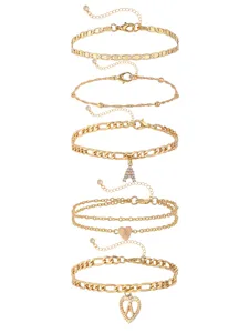 Stylish gold initial letter and heart charm layered anklet set for charming women.