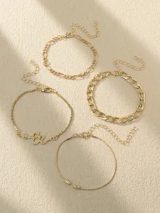 Trendy gold chain anklet and bracelet set featuring rhinestone snake charm for daily chic look